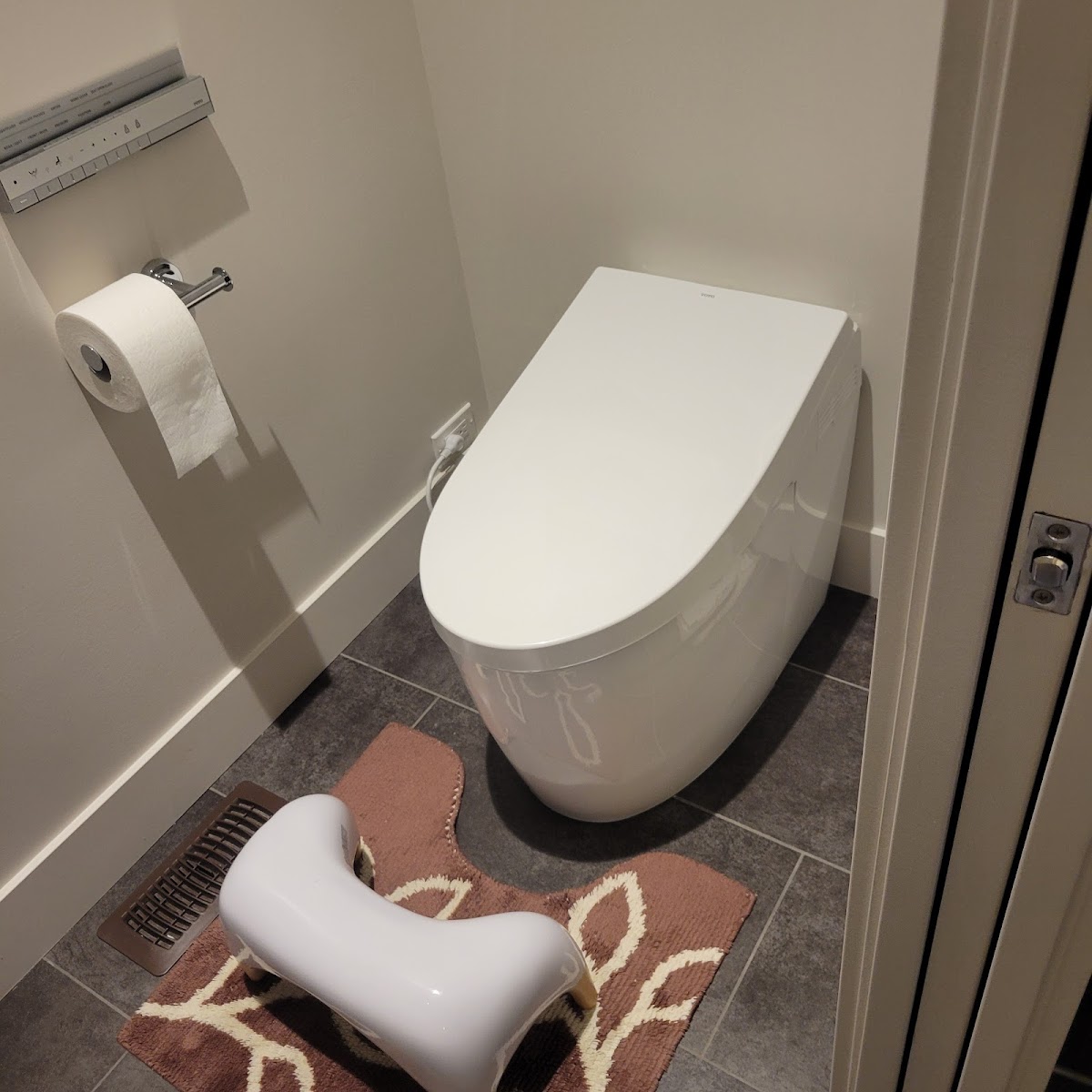 Installed smart toilet in a clean, modern washroom